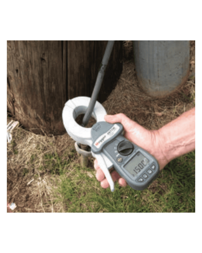 Megger DET24C clamp-on ground tester in use to test a pole ground