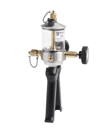 Side view of hydraulic hand pump showing metal body and pressure adjustment knob