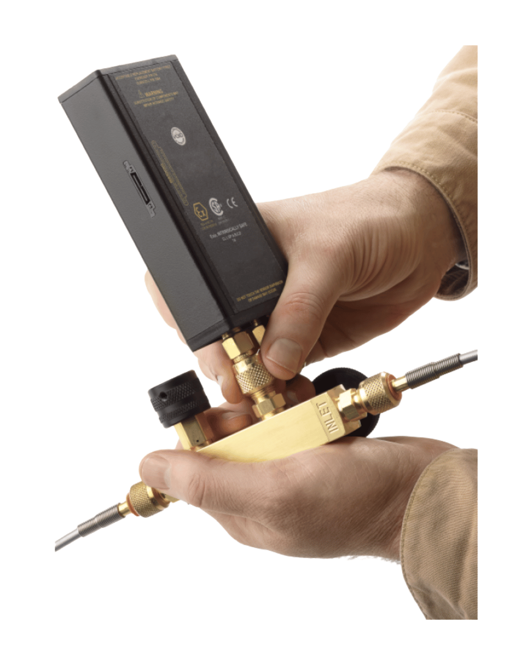 Hand Holding Ralston QTCM Pressure Calibration Manifold 